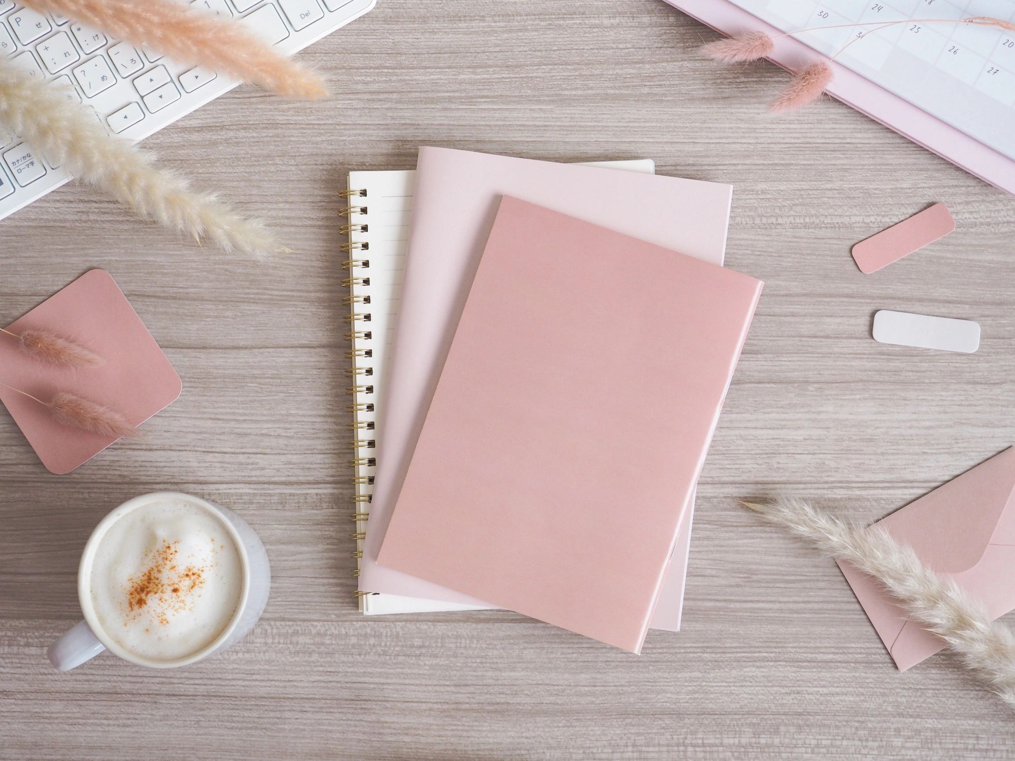 Blush-toned wellness workspace flat lay with copy space